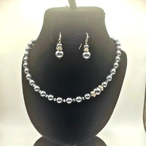 Black faux pearl necklace and matching earrings